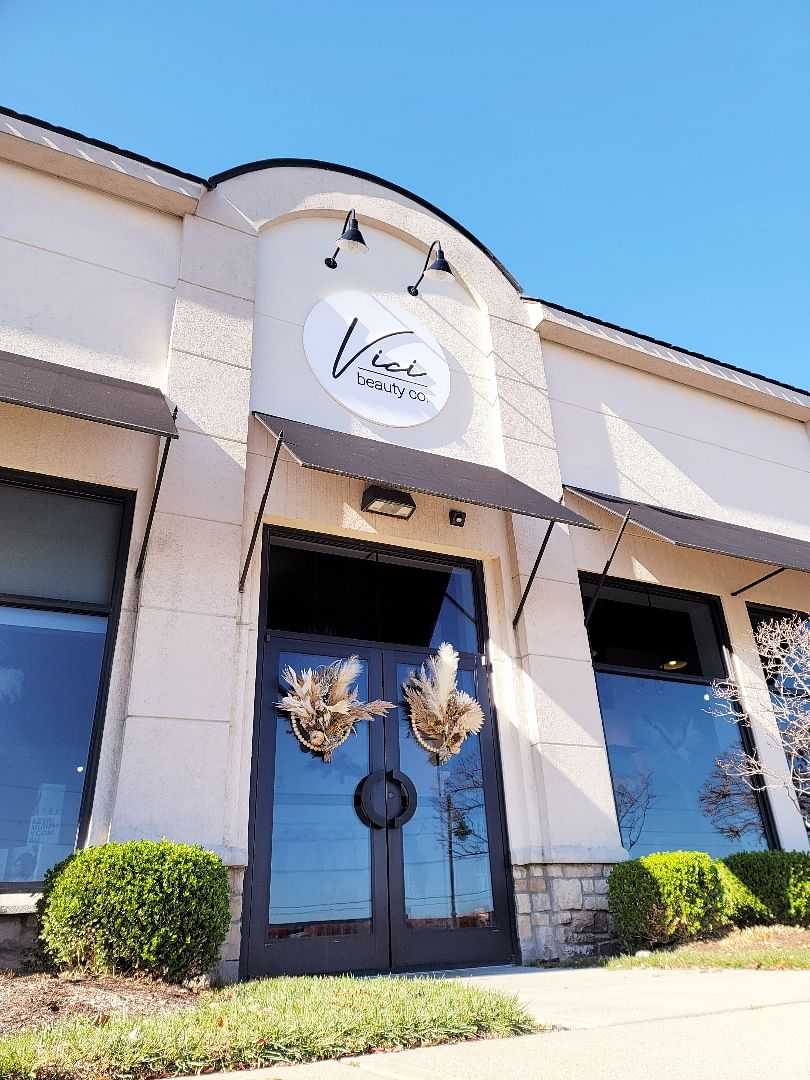 Storefront of Vera Beauty Co with logo and glass doors.