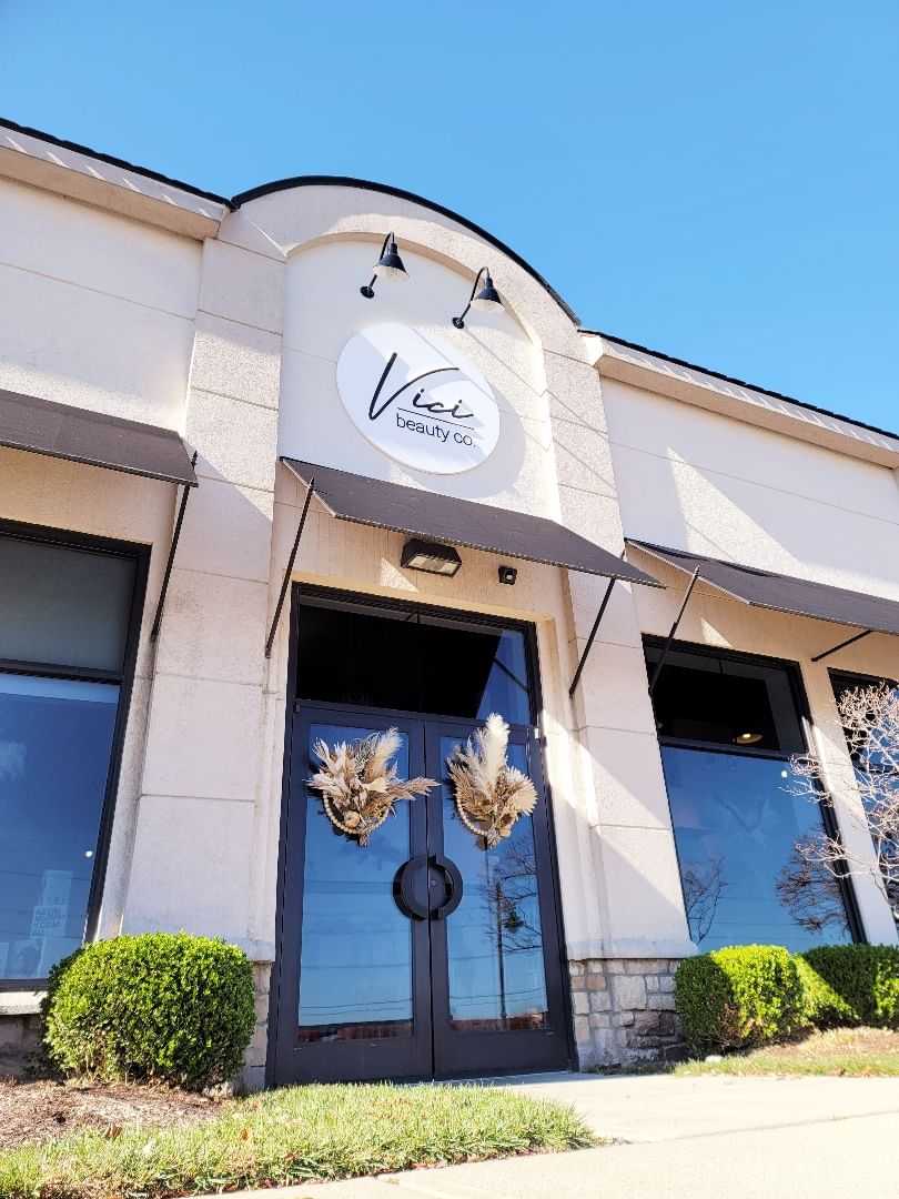 Storefront of Vera Beauty Co with logo and glass doors.